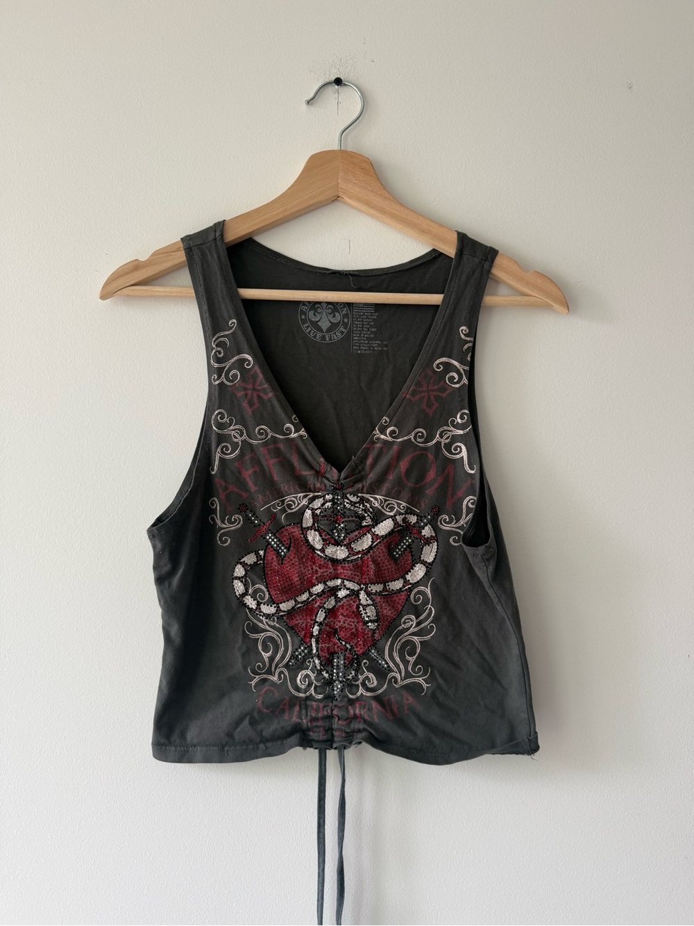 Women's Black Graphic V-Neck Tank Top with Red Heart Design